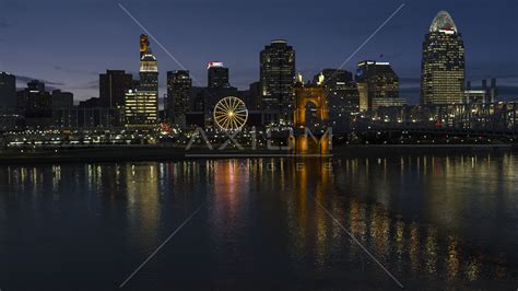 The urban heart of the region starting on the north bank of the ohio river. The city's skyline across the Ohio River at twilight ...