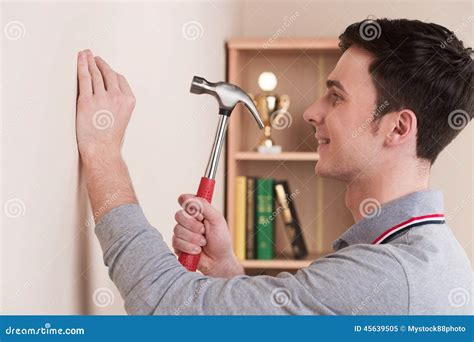 Handsome Young Man With Hammer At Home Stock Image Image Of Camera
