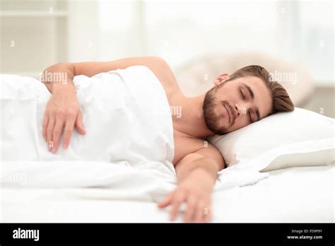 Handsome Man Sleeping In The New Bedroom Stock Photo Alamy