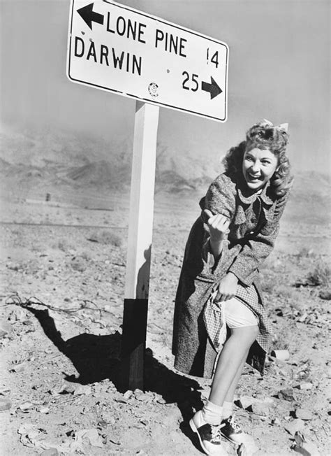 woman hitchhiking photograph by underwood archives