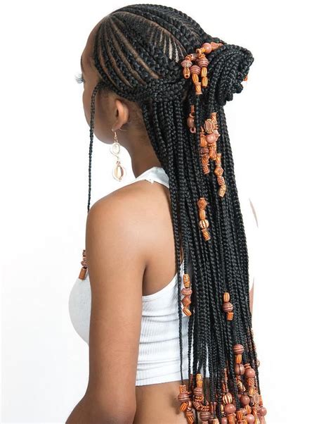 One or a few cornrows braided in the opposite direction toward your face just near the temples; 20 Trendiest Fulani Braids for 2021