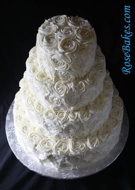 ivory buttercream roses wedding cake with lovebirds cake topper