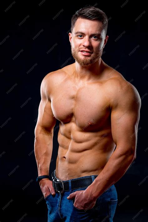 Premium Photo Strong Athletic Man Fitness Model Torso Showing Six Pack Abs Isolated On Dark