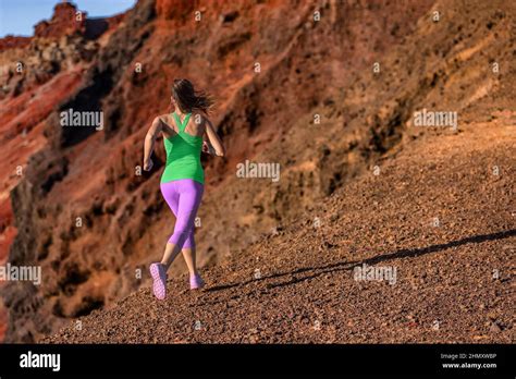 Trail Runner Woman Ultra Running Uphill On Volcano Mountainside Female