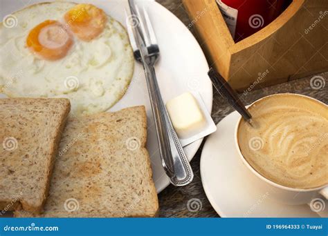 American Breakfast Or Continental Breakfasts Thai Style In Dining Room In Morning Time For