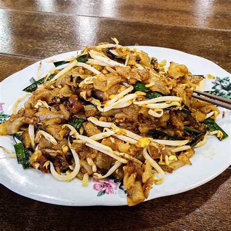 Brightly lit, with tables and chairs in a kaleidoscope of colours. 10 Must-Try Food At The Malaysia Boleh! Food Court In Four ...