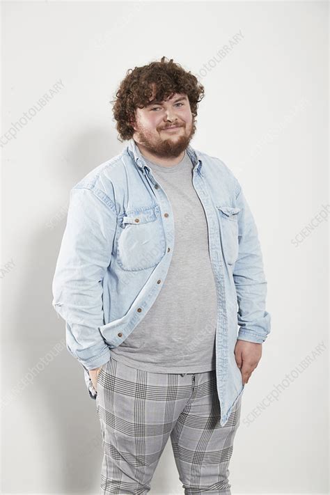 Portrait Young Man In Denim Shirt And Plaid Pants Stock Image F028