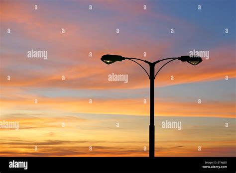 Silhouette Of Streetlight With Beautiful Twilight Background Stock