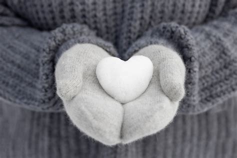 Free Photo Close Up Hands Holding Snow Heart