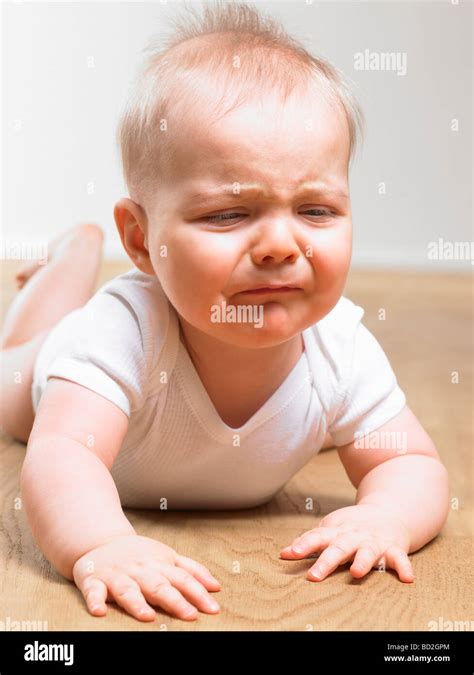 Baby Crying On The Floor Stock Photo Royalty Free Image 25257980 Alamy