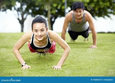 Young Asian Man And Woman Doing Push Ups Stock Image Image Of Healthy