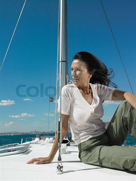 Mature Woman Relaxing On Yacht Stock Image Colourbox