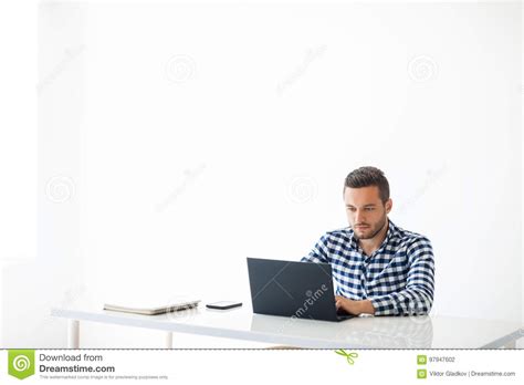 Portrait Of Handsome Man Typing On Laptop On White Background Stock