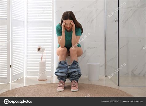 Woman Suffering Hemorrhoid Toilet Bowl Rest Room Stock Photo By Newafrica