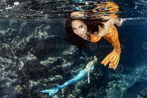 Mermaid Swimming Underwater In The Deep Blue Sea 20383746 Stock Photo