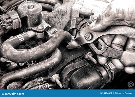 Auto Repair Mechanic Hand Fixing A Car Engine Part Stock Photography