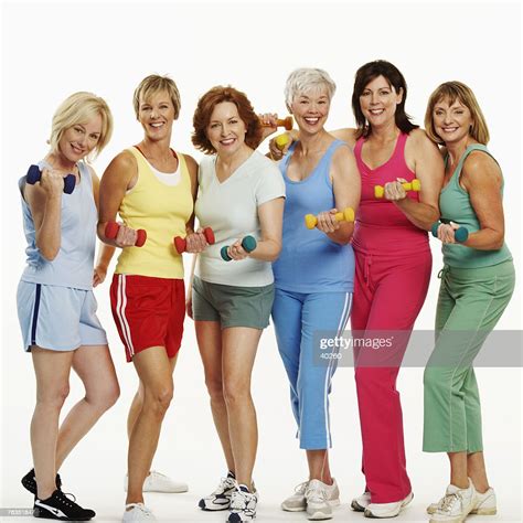 Portrait Of A Group Of Mature Women Holding Dumbbells And Smiling Photo