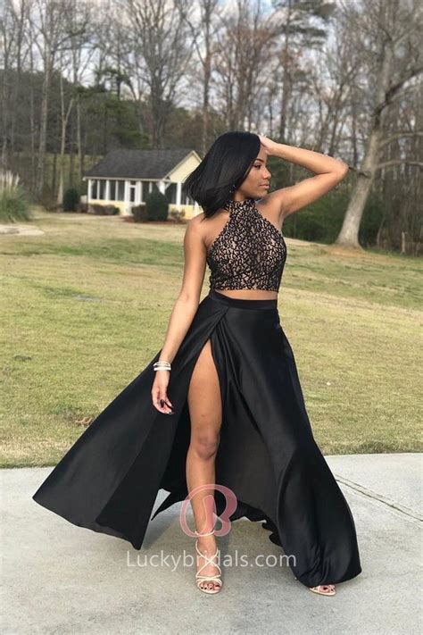 This Two Piece Black Prom Dress Consists Of A High Neck Lace Crop Top And A Flowy Black Satin S
