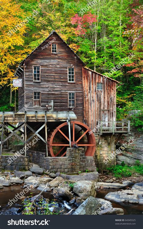 Red Water Wheel On Old Grist Mill In Gorgeous Autumn Fall Colors Stock