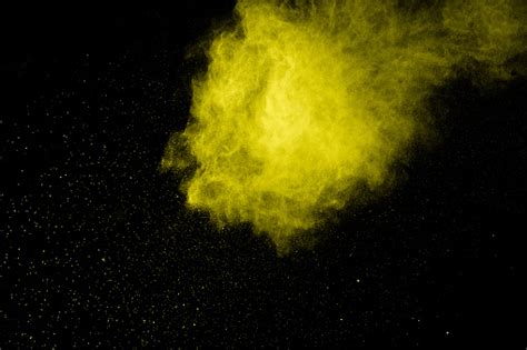 Yellow Dust Particles Explosion On Black Backgroundyellow Powder Splash