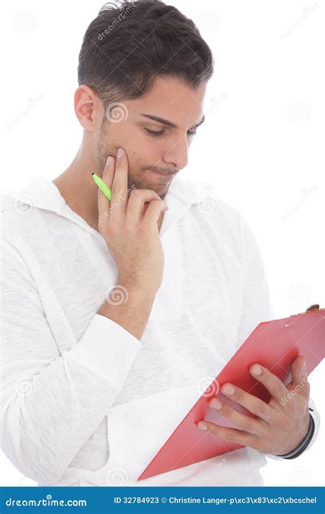 Young Man Reading Notes On A Clipboard Stock Image Image Of Looking