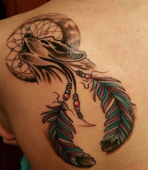 Wolf In A Dream Catcher Tattoo On The Shoulder Blade