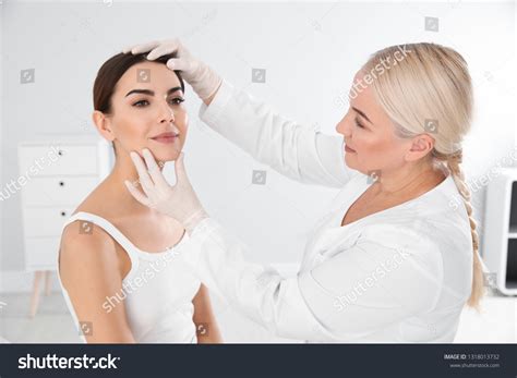 Dermatologist Examining Young Patients Birthmark Clinic Stock Photo