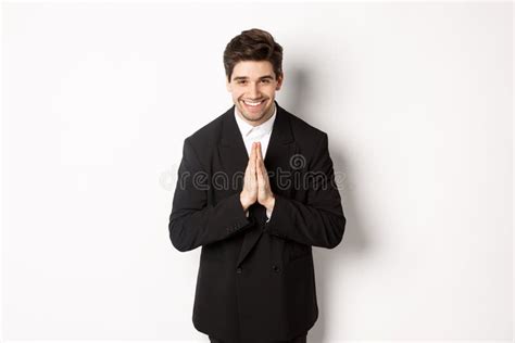 Portrait Of Handsome Man In Black Suit Being Grateful Saying Thank