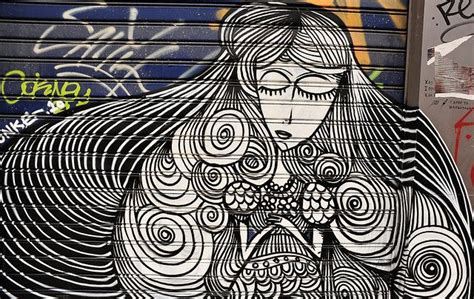 urban art girl with long hair uk best street art graffiti art