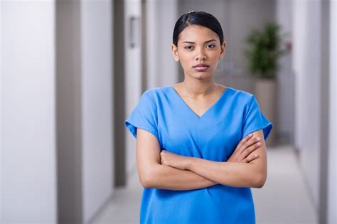 Premium Photo Portrait Of Nurse Standing With Arms Crossed
