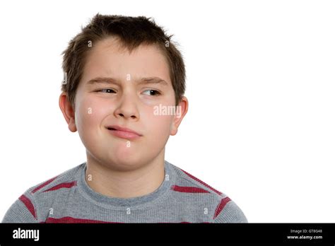 Close Up Ten Year Old Boy Looking To The Right With Bored Facial