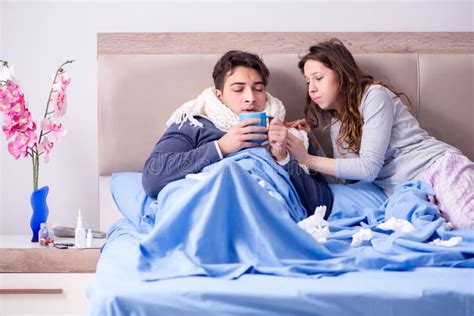 The Wife Caring For Sick Husband At Home In Bed Stock Image Image Of