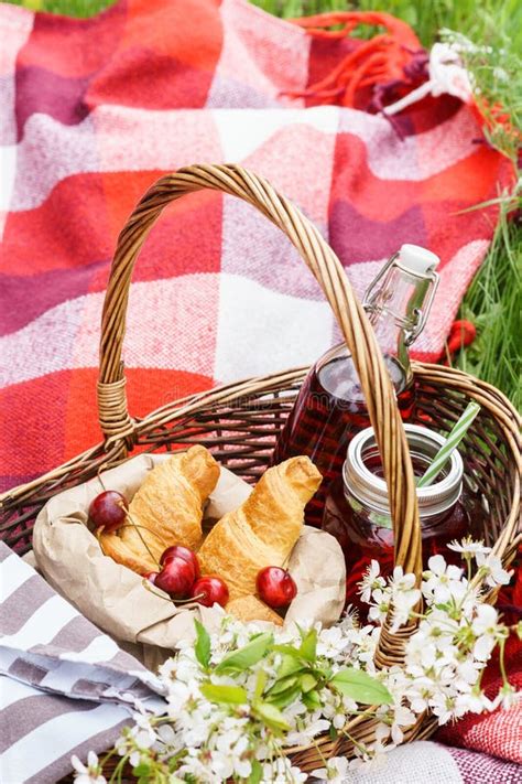 Cherry Juice In Mason Jar And Picnic Basket With Food Flowers Stock