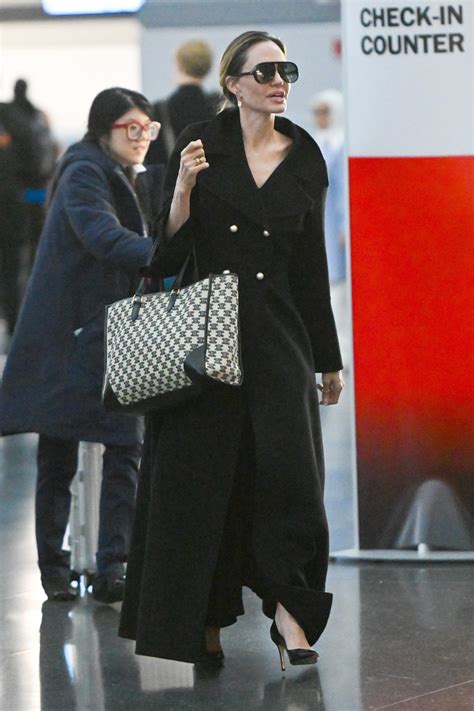 Angelina Jolie’s Airport Style Is Practically Black Tie Vogue