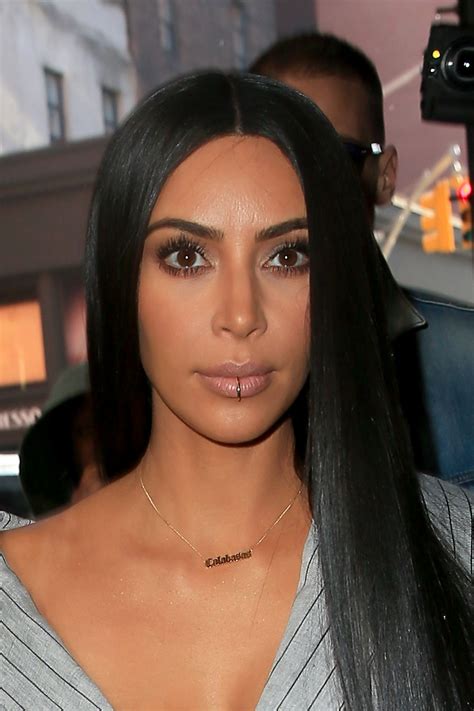 Kim Kardashian Sports A Lip Ring Extra Long Hair And Several Outfits