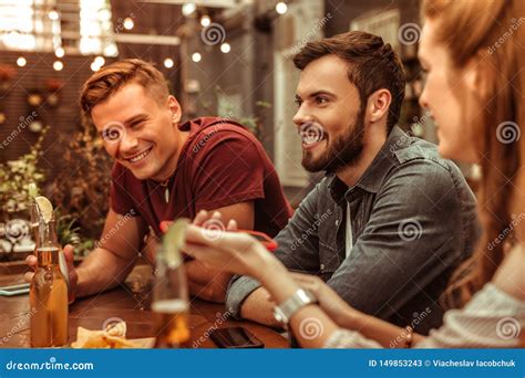 Smiling Young Adult Two Men Sitting At The Bar Table Stock Image Image Of Excited Longhaired