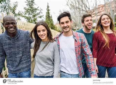 Group Of Multi Ethnic Young People Laughing Together Outdoors In Urban