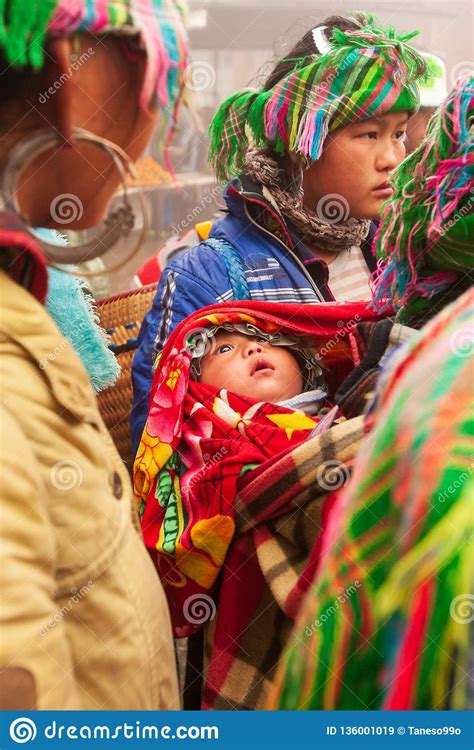 tribe-hmong-baby-infant-open-beautiful-eyes-and-looking-around-hmong-family-hmong-women-vendor