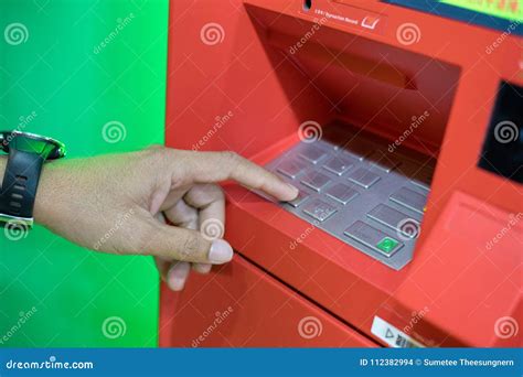 A Man Hand Entering Pinpass Code On Atmbank Machine Keypad Stock