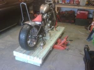 Homemade motorcycle lift constructed from wood. Homemade Motorcycle Lift - HomemadeTools.net