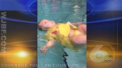 controversial video shows infant struggling to float in pool