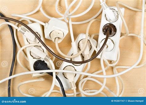 Convoluted Mess Of Power Sockets And Tangled Electrical Cables Tied