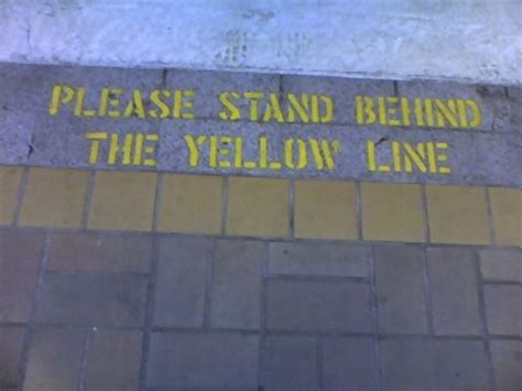 Please Stand Behind The Yellow Line At Signs