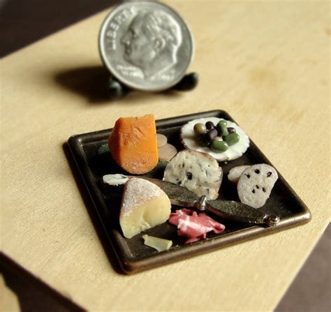 A Small Plate With Different Types Of Food On It Next To A Quarter