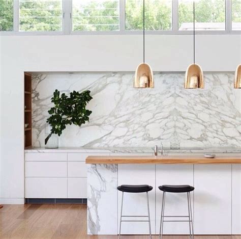 Modern White Calcutta Marble Kitchen Accented With Hints Of Copper