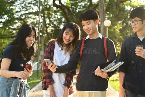 Diverse Young College Friends Talking To Etch Other While Walking After