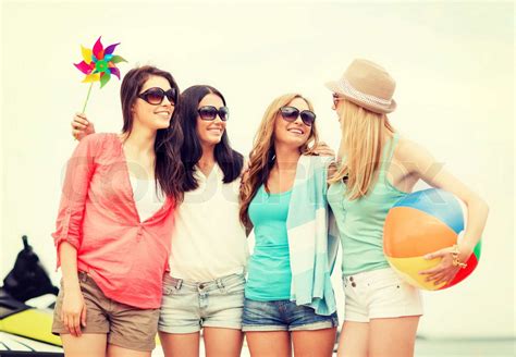 Smiling Girls In Shades Having Fun On The Beach Stock Image Colourbox