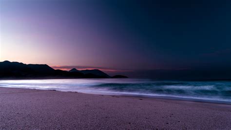 Download 3840x2160 Calm Beach Purple Sunset 4k Wallpaper Uhd