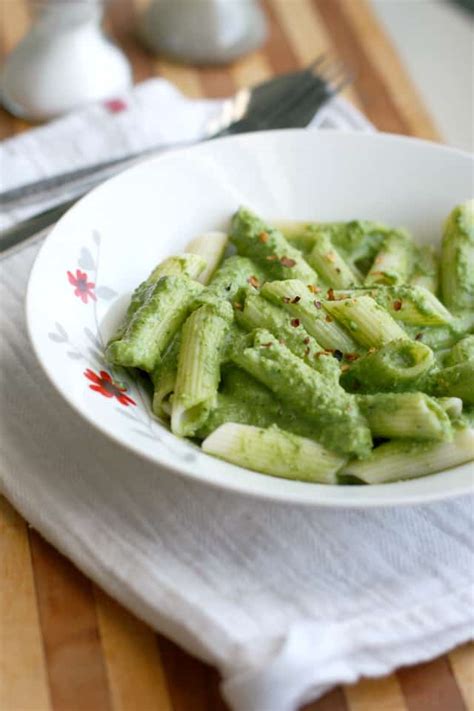 This healthy pesto sauce is about to become your new favorite sauce. Creamy Spinach Walnut Pesto Sauce. - The Pretty Bee