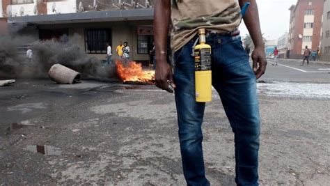 An Immigrant Armed With A Petrol Bomb On A Street In Durban South